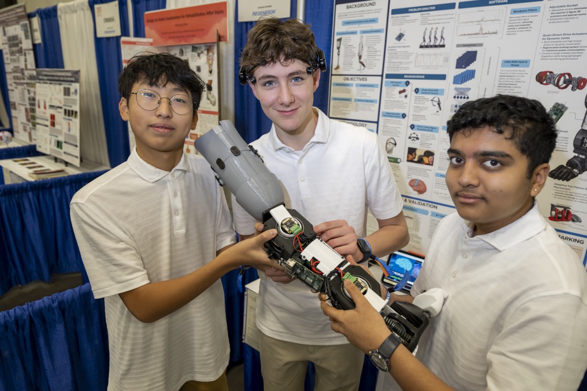Samuel Skotnikov and his teammates holding their Regeneron ISEF awards